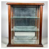 Glass Display Cabinet | Cabinet with two glass shelves Has mirrored back and bottom. Case opens from