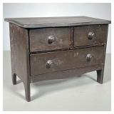 Miniature Chest | Chest in brown stain with satin-lined drawers. - l. 9.5 x w. 5 x h. 7 in 