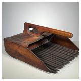 Cranberry Scoop | Vintage Cranberry Scoop with iron spikes. Marked “Make Peace & Co”. - l. 14.5 x w.