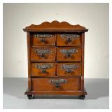 Spice Chest | Great Spice Chest with turnip feet, 7 drawers and attached scrolled metal nameplates. 