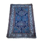 SMALL ANTIQUE RUG | Geometric devices, having four guls in scrollwork, ivory border with decorations