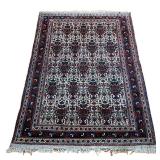 EARLY 20TH CENTURY PATTERN RUG | Red and ivory rug with depictions of birds and flowers. 