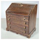 MINIATURE CHIPPENDALE DESK | Drop front desk with four drawers, brass pulls in stained pine. 