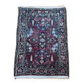 SMALL PATTERNED RUG | Red field with multicolored border. 