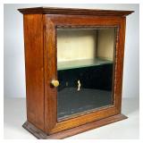 OAK DISPLAY CABINET | Cabinet with front glass door and one glass shelf. Turned molding around glass