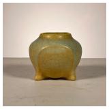 ROOKWOOD FOOTED VASE | A small vase in a light tan with a light blue overlay. Crackle lines through 