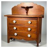 MINIATURE CHEST WITH BACKSPLASH | Chest with three drawers. Backsplash has candle stand. 