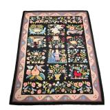 AMERICAN PICTORIAL HOOKED RUG | Showing birds among flowers and vines with an amorous couple and Cup