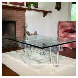LUCITE & GLASS LOW TABLE | Tempered glass top on a brutalist style Lucite base. - l. 48 x w. 36 x h.