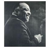 COUNT BASIE SILVER GELATIN PRINT | Framed silver gelatin print of Count Basie with cigarette. - l. 2