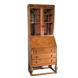 SLANT LID BOOKCASE | double glazed doors over a fall front over three drawers; atypical narrow propo