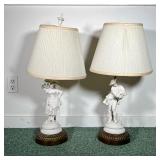 (2PC) PAIR BISQUE FIGURINE LAMPS | Pair of white bisque figurine lamps depicting a man and a woman i
