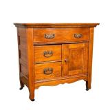 SMALL CABINET ON CASTERS | Small cabinet with large central drawer, 2 smaller drawers and large stor