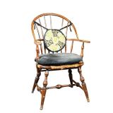 SACK BACK WINDSOR ARMCHAIR | Having a sack back with rush seat, old finish. - l. 26 x w. 25 x h. 38.