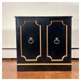 Black & Gold Cabinet | Small side / storage cabinet with double doors revealing an interior shelf. -