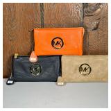 (3pc) Michael Kors Wallets | Soft, leather wallets one in orange, one in black, and one in light bro