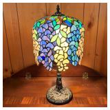 STAINED GLASS LAMP W/BLUE GREEN SHADE | Ornate tree design on bronze color base. Helmet design shade