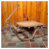ICE SLED | A 19th C Working Ice Sled with great ironwork runners and handle brace. - l. 30 x w. 25 x
