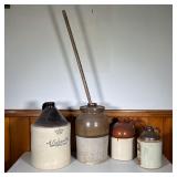 (4PC) VINTAGE STONEWARE JUG LOT | Lot Includes: (1) B-H Pure White Shellac Brown & White Jug (1) Tan