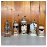 (5PC) GERMAN STEINS | Lot Includes: (1) Amber Painted Glass with relief. (1) Relief Figures on green