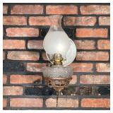 (2PC) BRACKET OIL LAMPS | Two 19th C Iron Bracket Oil Lamps: (1) Large Ornate Iron Bracket painted b