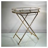 MIRROR TOP SIDE TABLE | Gold-painted mirror top side table with bamboo-style folding metal legs. - l