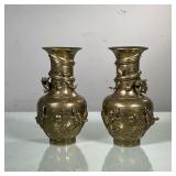 (2PC) PAIR CHINESE BRASS VASES | Decorated with swirling dragon relief spiraling around vase with et