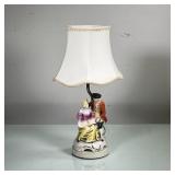 CERAMIC COUPLE FIGURINE LAMP | Small ceramic figurine depicting husband and wife turned into a lamp.