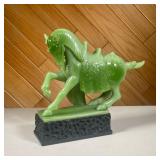 COMPOSITION CHINESE HORSE FIGURE | Ornate faux jade horse on a black carved pedestal. - l. 12.5 x w.