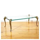 SPANISH GLASS AND BRASS LOW TABLE | Finely cast and chased brass cabriole legs affixed to a tempered