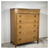 NATIONAL FURNITURE CO. TALL DRESSER | 20th century, light-colored wood; tall dresser with 5 full-wid