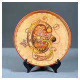 HAND PAINTED DECORATIVE WOOD PLATE | Hand-painted, colorful decorative wooden plate. Verso labeled “