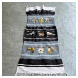 FLAT WOVEN MEXICAN MAT | Woven fabric in stripes of black, white, and blue, and decorated with decor