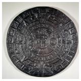 PRESSED MAYAN CERAMIC PLAQUE | Circular black ceramic plaque with circular Mayan design in a radial 