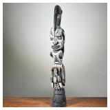 HAND CARVED & PAINTED AFRICAN STATUE | Carved wood statue depicting multiple animals and a human fac