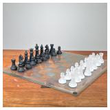 GLASS CHESS SET | Clear glass chessboard featuring sandblasted glass white pieces and black glass pi