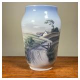 DANISH PAINTED VASE | Depicts countryside scene with river, stamped Royal Copenhagen. - h. 10 x dia.