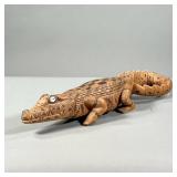 CARVED CROCODILE STATUE | Hand carved and painted crocodile statue with seashell eyes. - l. 21 x w. 