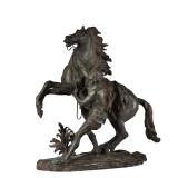 CLASSICAL HORSE SCULPTURE | Patinated metal, showing a man taming a horse; no apparent signature - l