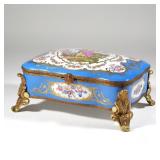 SEVRES STYLE PORCELAIN BOX | With acanthus leaf dore bronze mounts - l. 13.26 x w. 9.25 x h. 6 in. 