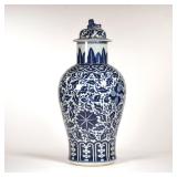 CHINESE BLUE & WHITE LIDDED JAR | Decorated with scrolls and leaves, the lid with a foo dog finial -
