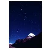 GALEN ROWELL (1940-2002) PHOTOGRAPH | Star Streaks over Mount Kailas. Color print, 1987/94. 19 x 12.