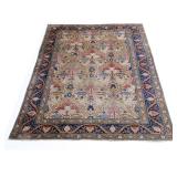 ANTIQUE TABRIZ CARPET | Having an overall pattern with leaves and vines and animals cream ground wit