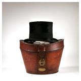LEONARDS TOP HAT IN FITTED CASE | Leonards Hat Makers, London, in a fitted leather case.