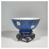 CHINESE PORCELAIN BOWL | Exterior painted with pink, green, and yellow medallions on blue ground. - 