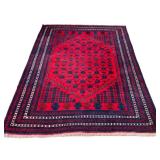 AFGHAN/BELOUCH CARPET | Worked with a stylized floral motif and five borders in shades of red, brown