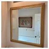BEVELED GLASS MIRROR | Beveled glass mirror in gilt frame. - l. 34.5 x w. 32.5 in 