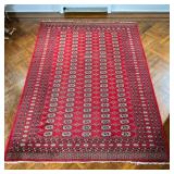 RED GEOMETRIC RUG | Having geometric medallions on red background. - l. 106 x w. 74 in 