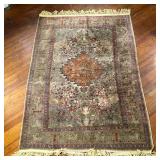 TREE OF LIFE CARPET | Pattern of trees around a central salmon medallion, within a border of animals