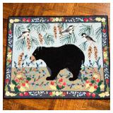 CLAIRE MURRAY HOOKED RUG | Small area rug having a black bear amongst flowers, labeled on the back. 